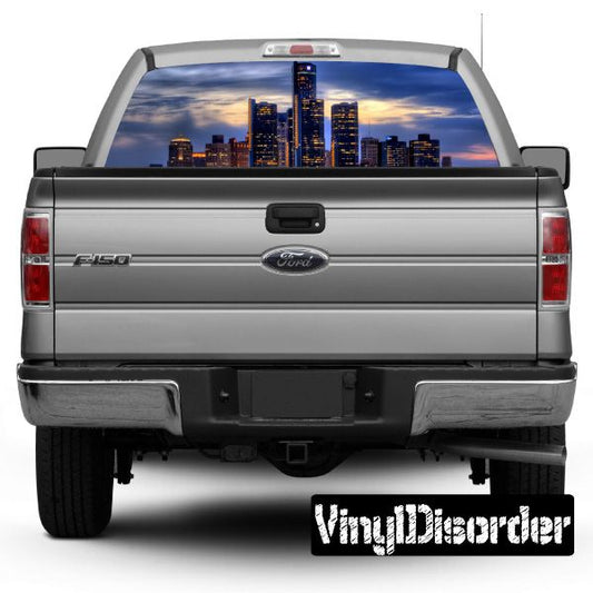 Gray pickup truck rear window skyline graphic, Chicago-style city skyline scene
