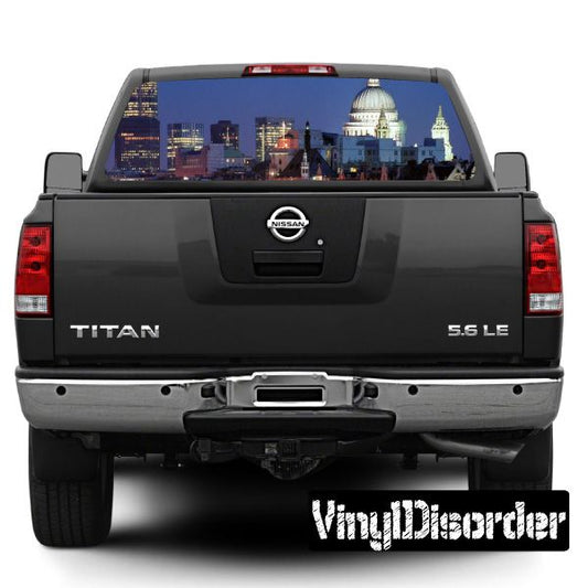 Rear window view graphic featuring a London skyline scene on a dark pickup truck