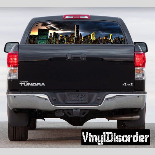 Pickup truck rear window graphic with city skyline view