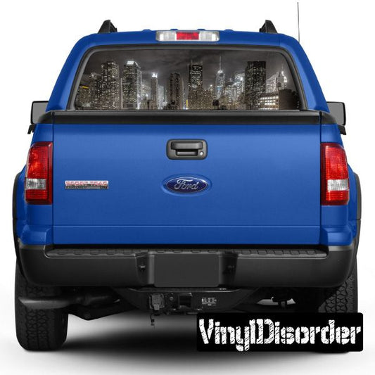 Blue pickup truck rear view with graphic rear window and tailgate