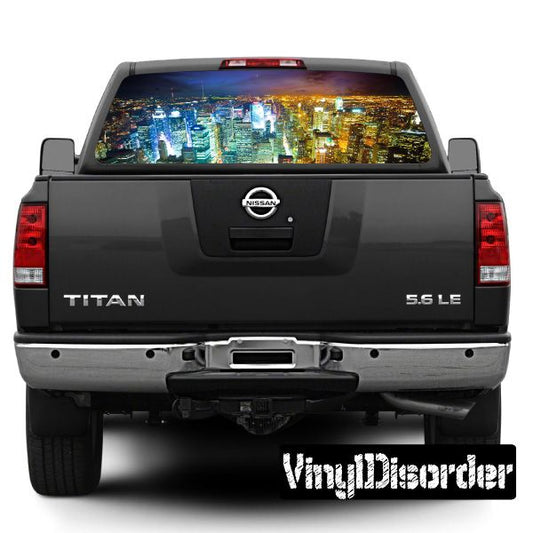 Black Nissan Titan tailgate with skyline graphic rear window view and VingDicorder plate