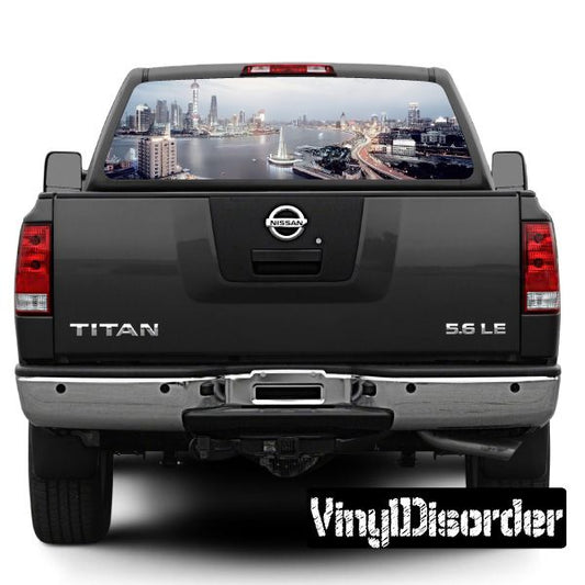 Pickup truck rear window skyline graphic on dark tailgate