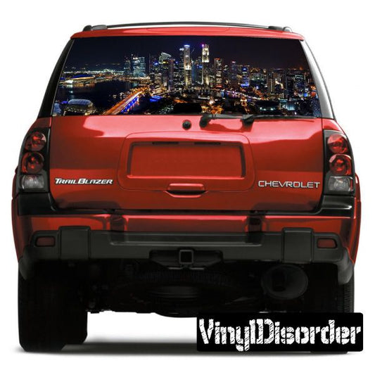 Red SUV rear with skyline graphic on rear window, Chevrolet and TrailBlazer badges