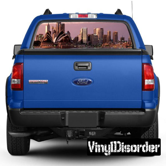 Rear window graphic decal showing Sydney skyline view on a blue pickup trunk