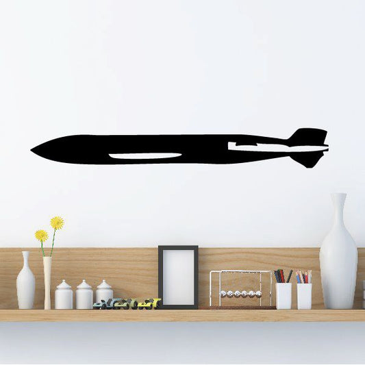 Black torpedo-shaped wall decal with sleek horizontal stripes and tip
