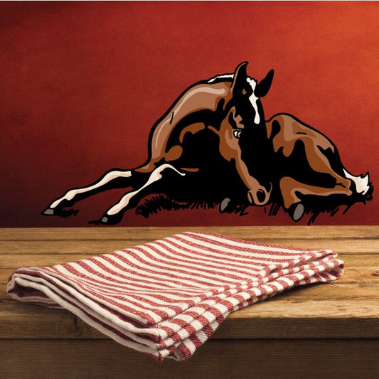 Sleeping foal animal sticker with dark and tan markings