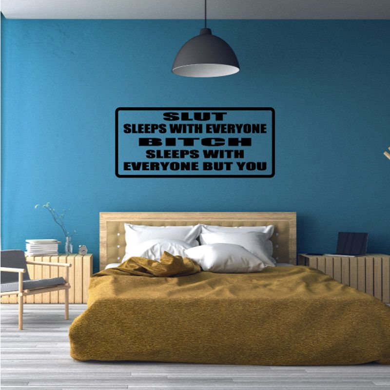 Wall decal plaque reading “S L U T sleeps with everyone but you” in black and red