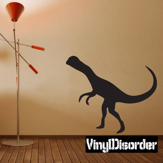 Black Dilophosaurus wall decal with snout down and raised crest
