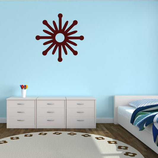 Snowflake decal with red radial snowflake design, centered on the wall.