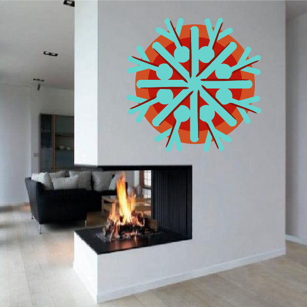 Snowflake sticker with teal and orange radial snowflake pattern