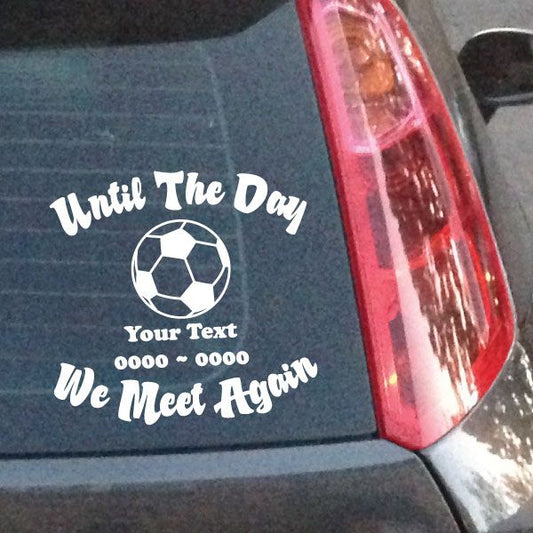 In loving memory soccer ball decal with white script text on dark surface