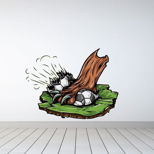 Soccer mascot wall decal of a cartoon player with a ball on grass