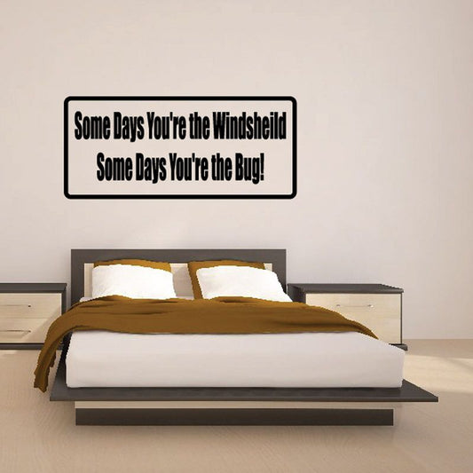 Rectangular wall decal with text: 'Some Days You're the Windshield' / 'the Bug'.