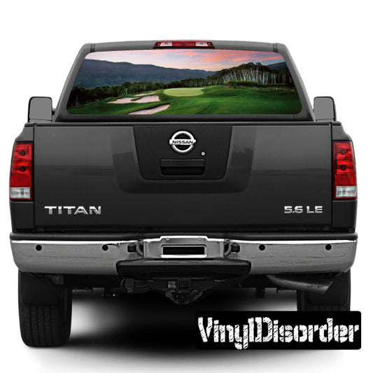 Pickup truck rear tailgate with golf course rear window graphic decal