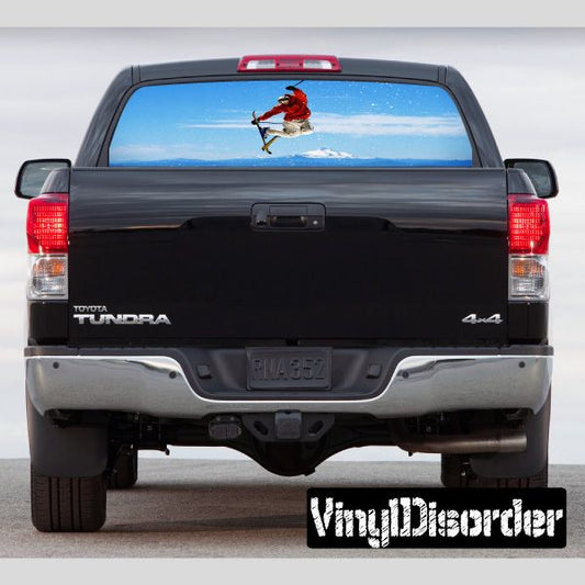 Black pickup truck rear with large rear window graphic of a skier jumping