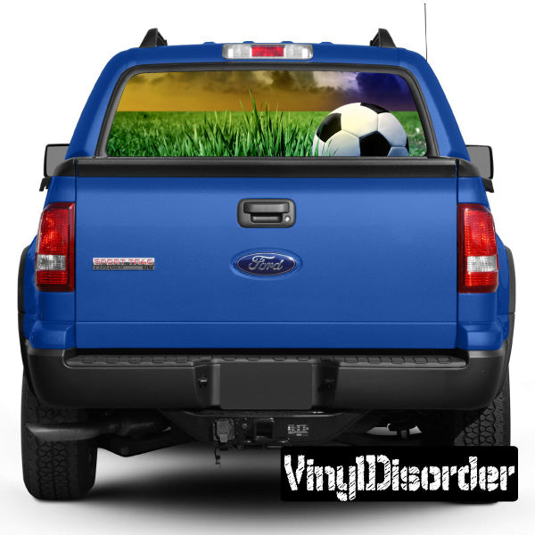 Rear window view-through soccer graphic with green grass and soccer ball
