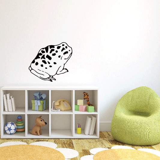 Spotted toad decal with black outline and dark spots on a light background