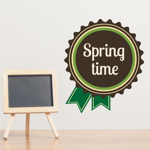 Spring time ribbon decal with circular badge and banner, brown and green with white lettering