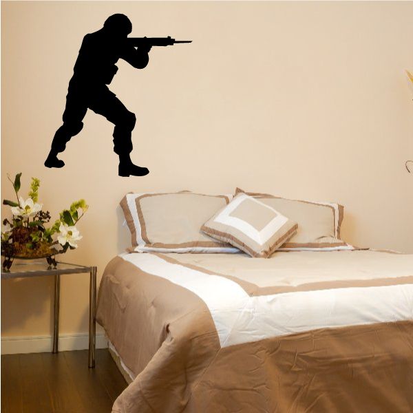 Standing soldier aiming rifle wall decal, black silhouette