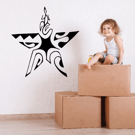 Black star wall decal with ornate swirl accents