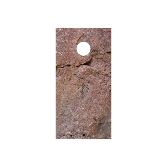 Stone cornhole board wrap with reddish rock texture and round top hole