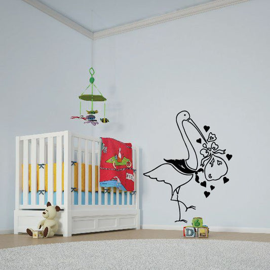 Baby wall decal: black stork carrying a swaddled baby with hearts