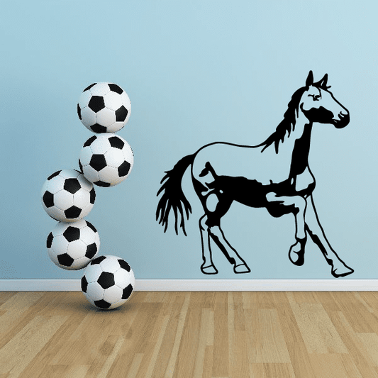 Horse and soccer ball wall decal, black outline pony with white-and-black balls