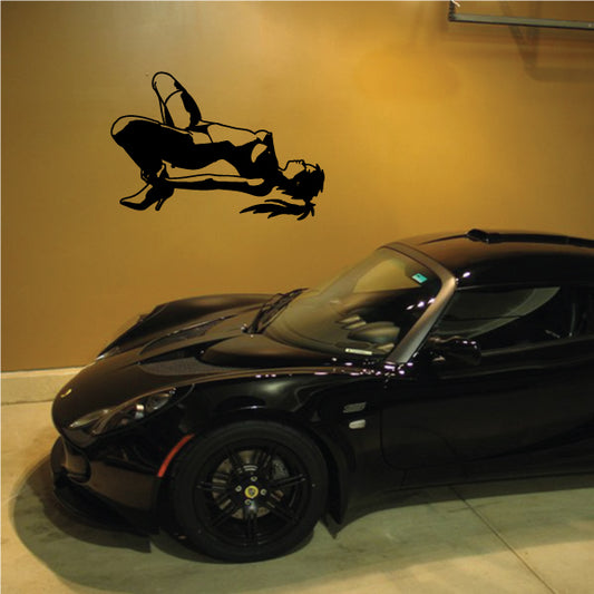 Black stripper silhouette wall decal, reclining with legs raised and one arm up
