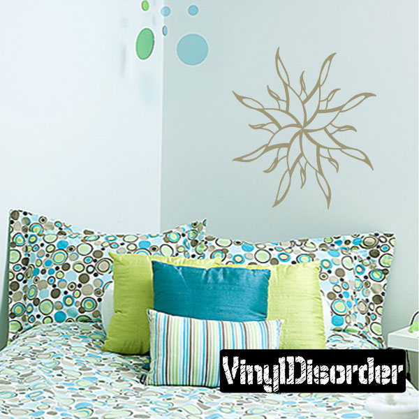 Wall decal of a sun design above a bed in a styled bedroom setting