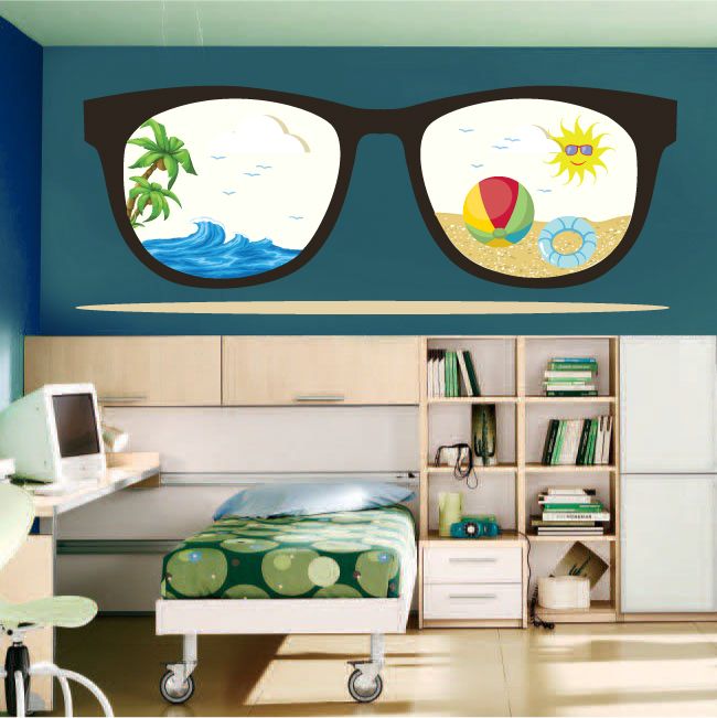 Sunglasses with beach scene stickers on dark frames, rounded lenses