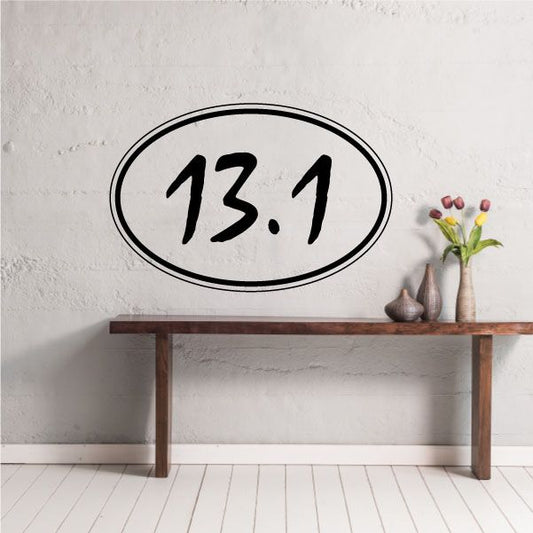 Marathon sticker with oval border and bold black “13.1” text