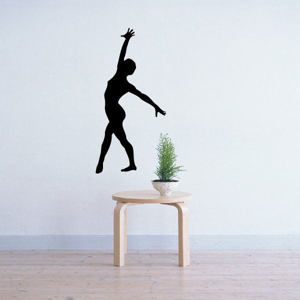 Gymnastics pose wall decal with black silhouette of standing athlete raising one arm
