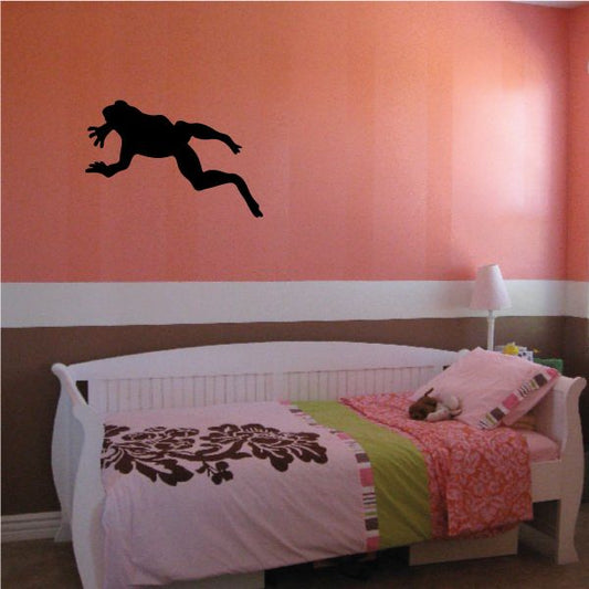 Swimming frog decal sticker, black frog silhouette mid-swim on wall