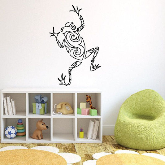 Frog decal with swirling hollow design in black outline