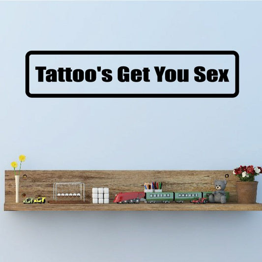 Wall decal with text "Tattoo's Get You Sex" in black lettering, white border