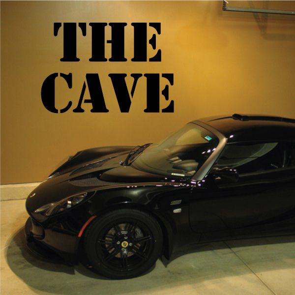 Black wall decal letters reading 'THE CAVE'