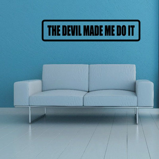 Black wall decal with bold 'THE DEVIL MADE ME DO IT' lettering.
