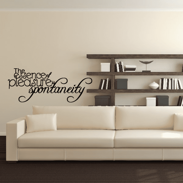 Cursive wall decal with quote: 'The essence of pleasure is spontaneity'.