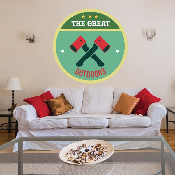 Circular camp badge wall decal with green center, yellow ring, crossed axes, THE GREAT OUTDOORS.