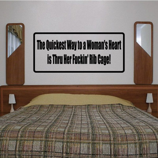 Typographic wall decal text: "The Quickest Way to a Woman's Heart is Thru Her Fuckin Rib Cage"