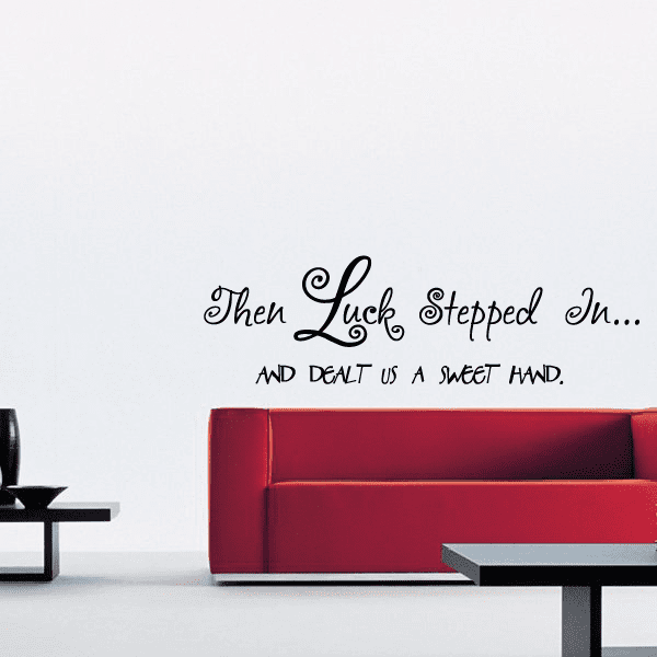 Black script wall decal reading: “Then Luck Stepped In... and a sweet hand.”