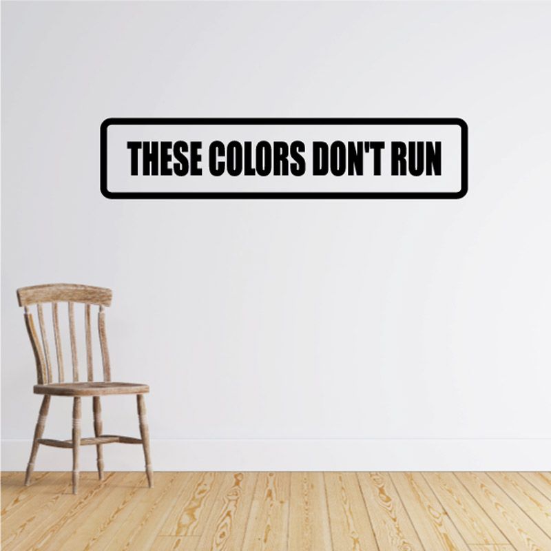 Wall decal with black outline and bold text "THESE COLORS DON'T RUN"