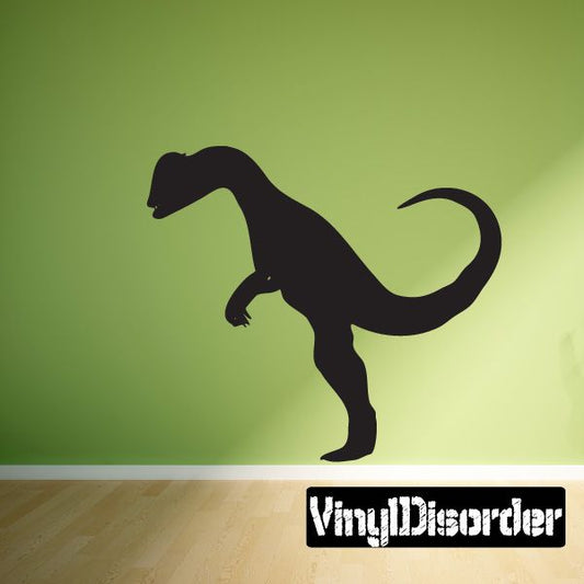 Black dinosaur silhouette wall decal with open frill and raised tail