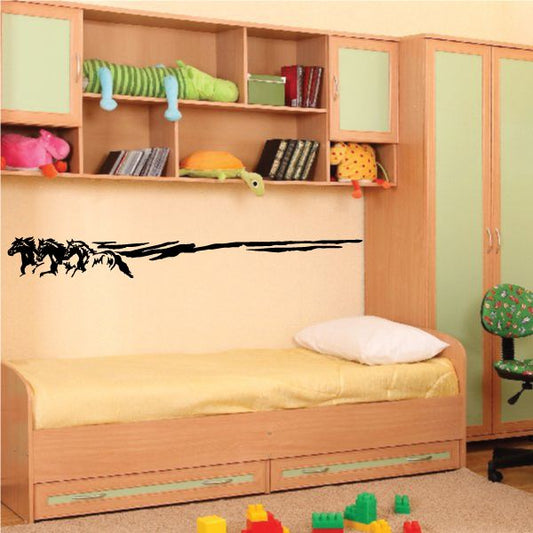 Black silhouette three horses sprinting wall decal, horizontal stripe design.