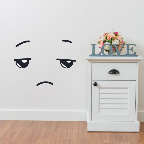 Vinyl wall decal of a tired face emoticon with curved brows and downturned eyes