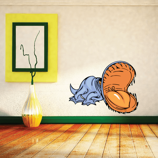 Toothy dinosaur wall sticker with orange head and blue body, cartoon style.