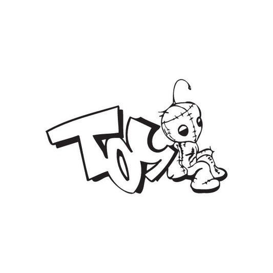 Graffiti-style decal with black tag letters and small cartoon character outline