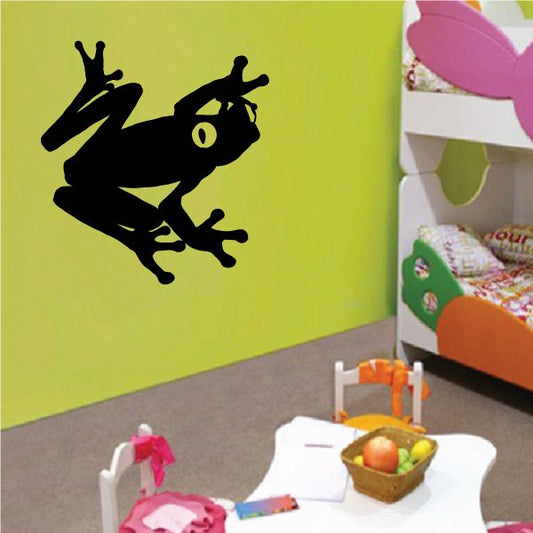Black tree frog wall decal with raised head and long front legs silhouette