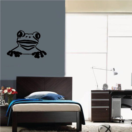Tree frog peeking wall decal with black and white face and stripes