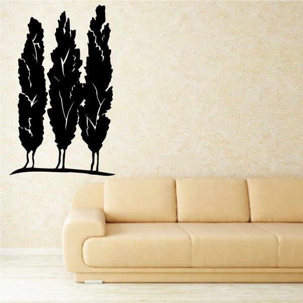 Black tree wall decal silhouette with three tall trunks and leafy tops.